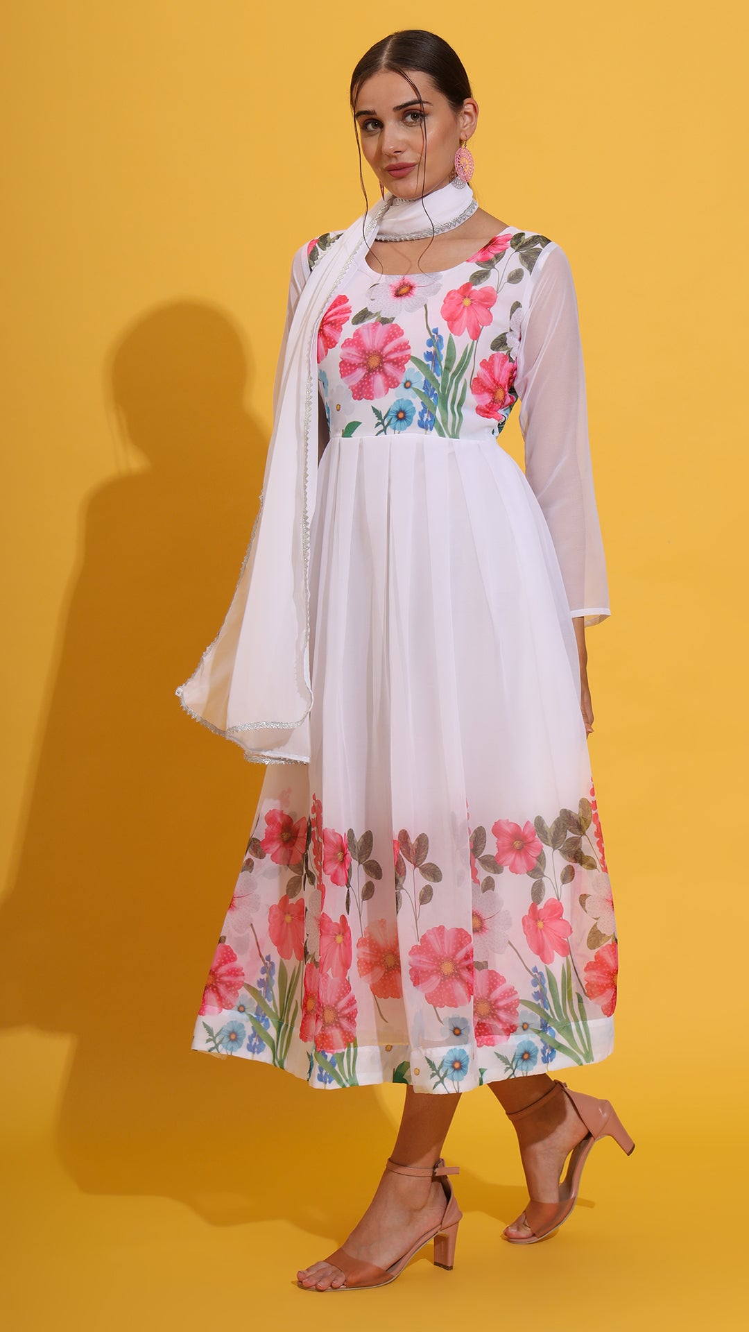 Premium white floral gown set featuring delicate prints and dupatta